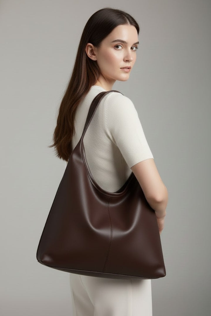Versatile black women's tote bag, classic faux leather, perfect for work or casual use.
