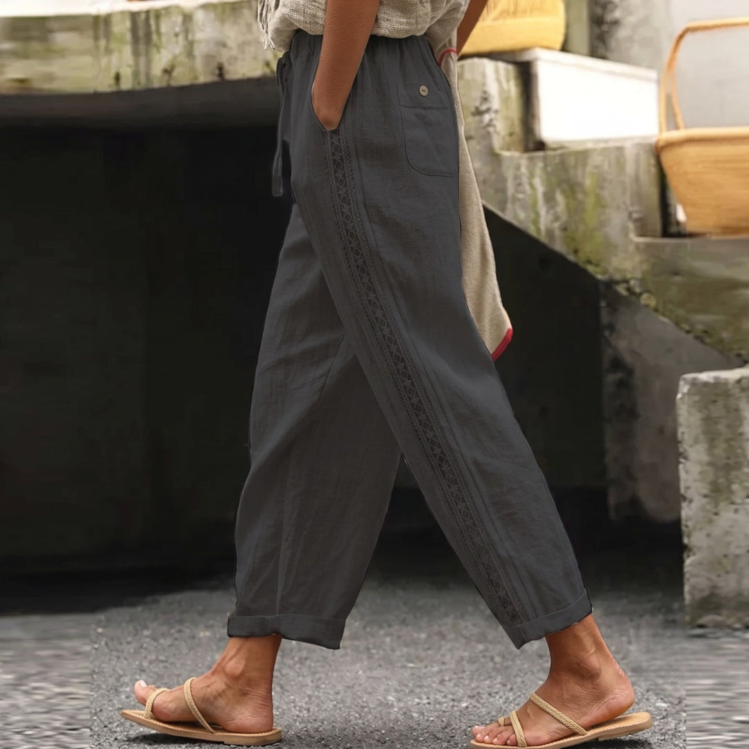 Striped women's high waist trousers, ankle length & tapered for a flattering fit. Versatile for casual or business casual wear.