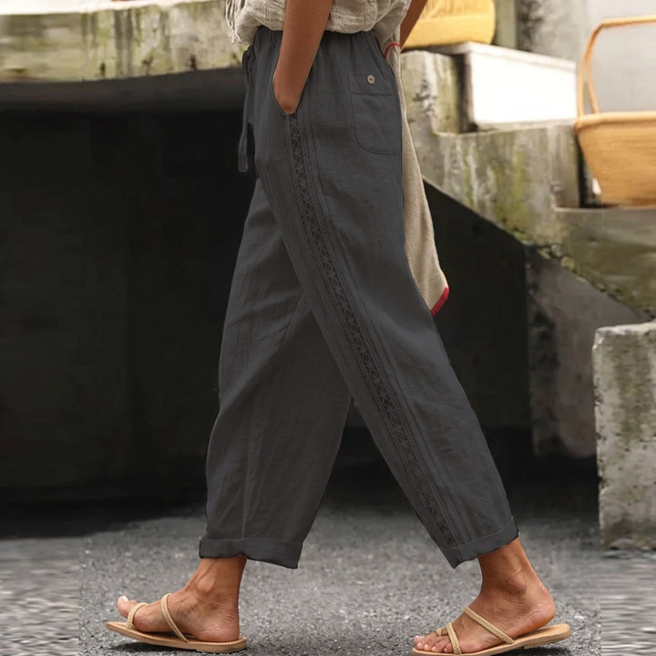Striped women's high waist trousers, ankle length & tapered for a flattering fit. Versatile for casual or business casual wear.