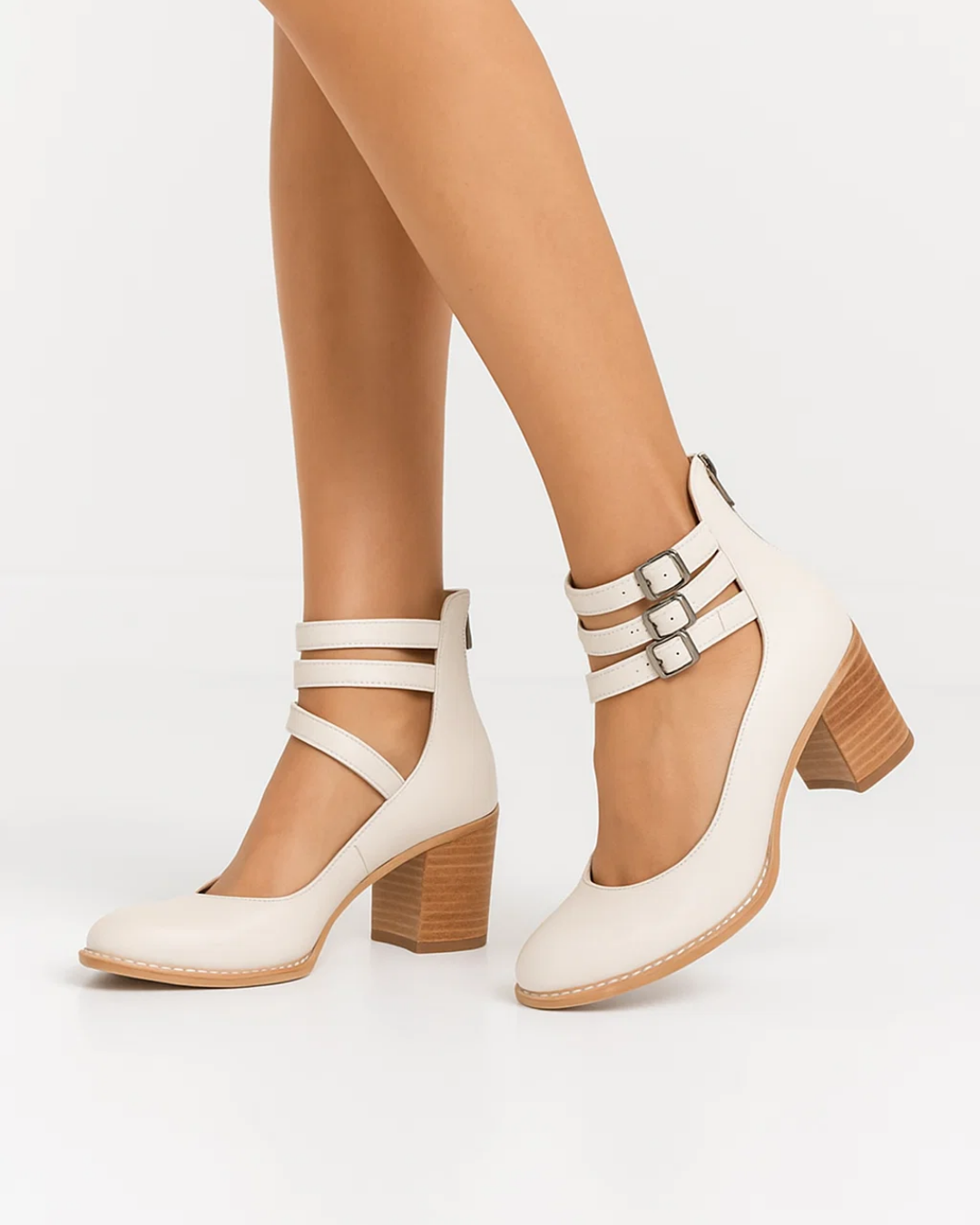 Chic women's dress pumps featuring a sturdy block heel, elegant ankle strap, and comfortable round toe design.