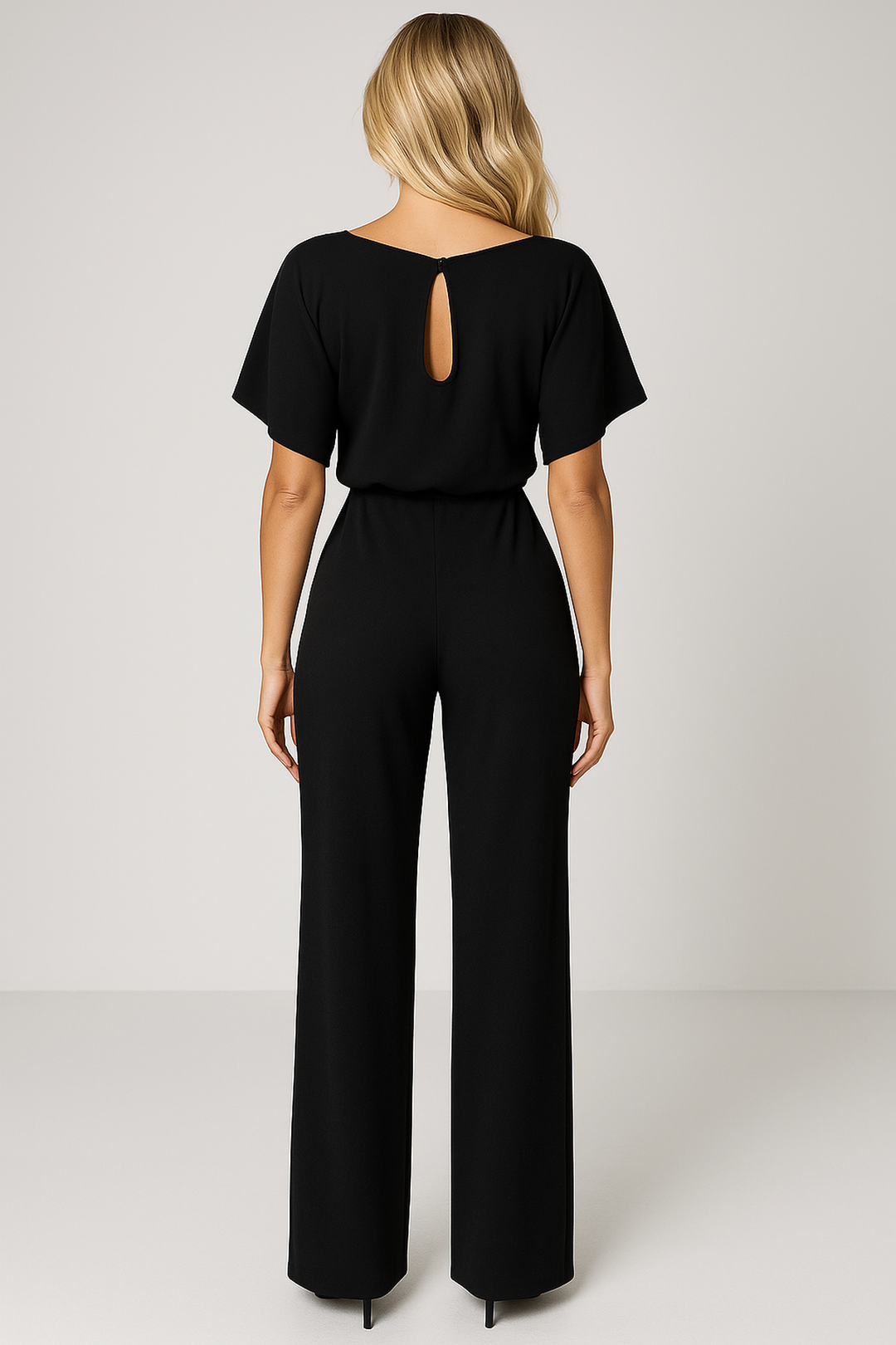 Women's elegant wide leg jumpsuit with short sleeves and a stylish, defining waist tie.