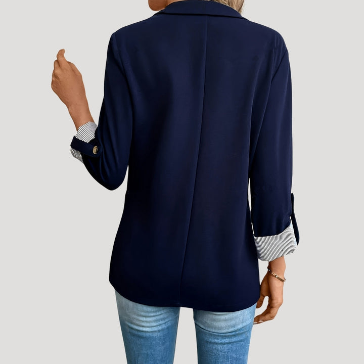 Chic women's tailored blazer for work or casual wear. Single-breasted design with stylish roll-up sleeves for comfort.