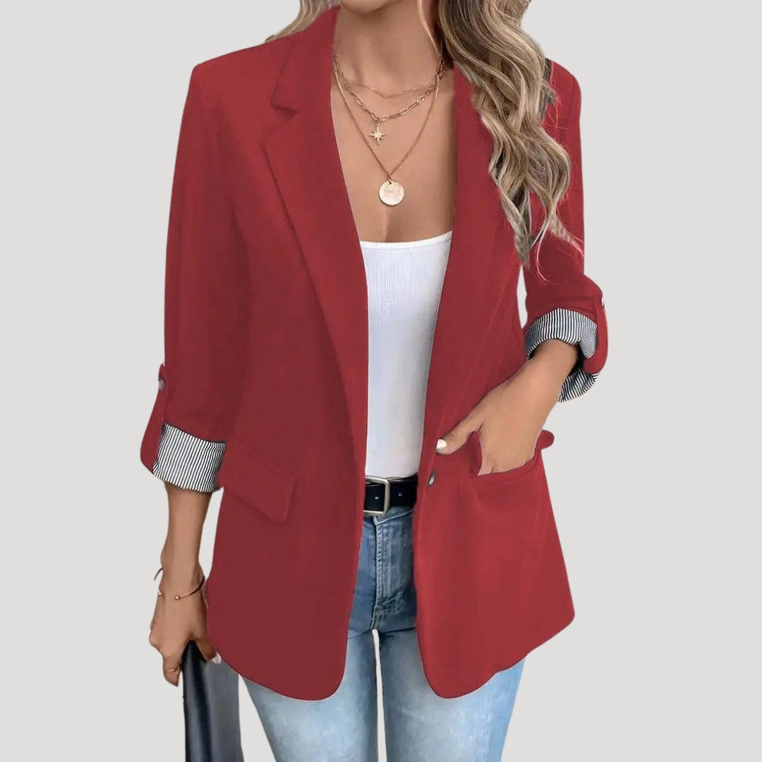 Stylish women's blazer featuring roll-up sleeves for a versatile look. Tailored, single-breasted, perfect for summer fashion.