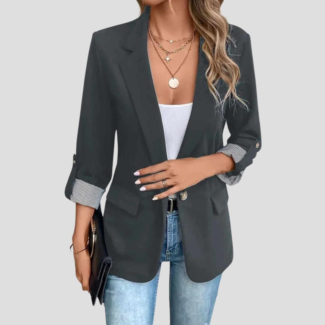 Modern women's tailored fashion blazer. Single-breasted with functional roll-up sleeves for a contemporary chic look.