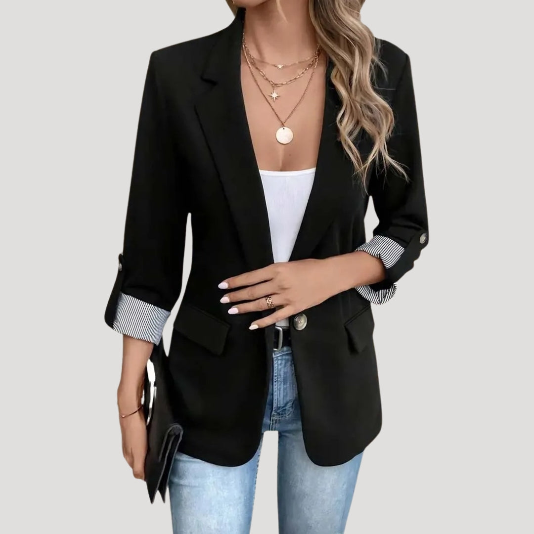 Elegant women's single-breasted blazer. Tailored fit & roll-up sleeves make it a versatile jacket for work or daily wear.