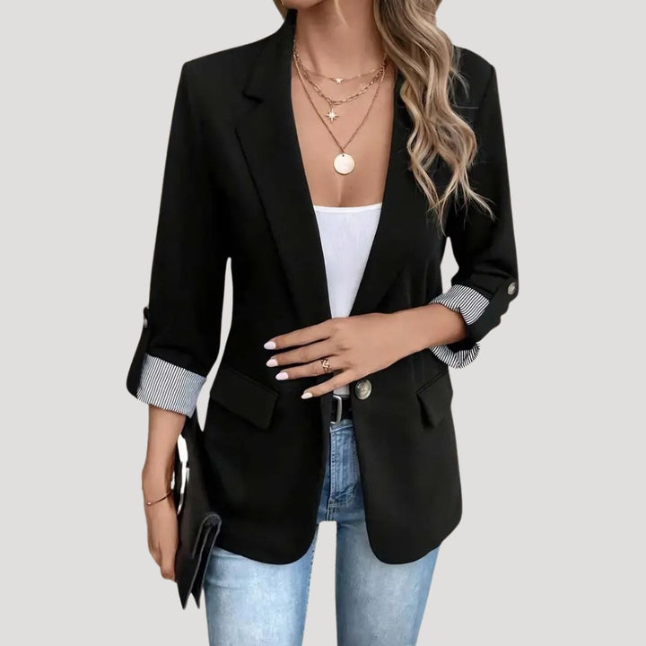 Elegant women's single-breasted blazer. Tailored fit & roll-up sleeves make it a versatile jacket for work or daily wear.