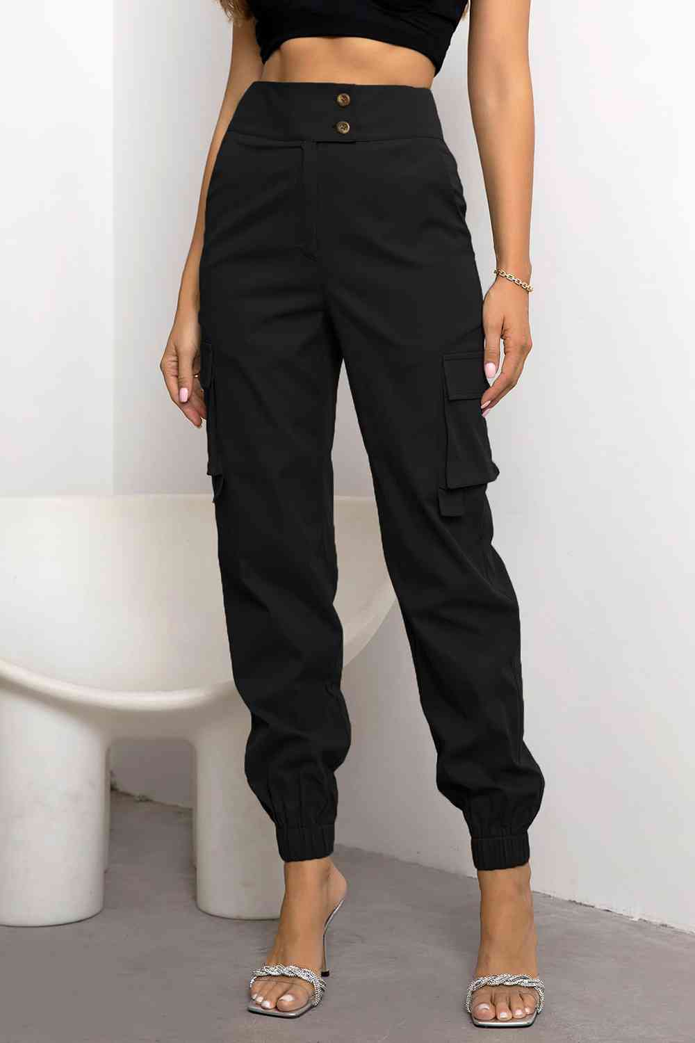 Women's black high-waist cargo trousers. Sleek, modern fit utility pants perfect for urban fashion & casual wear.