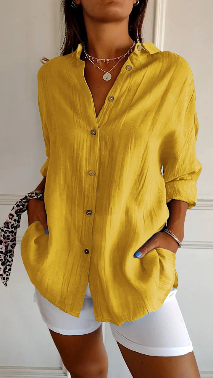 Versatile women's crinkled long sleeve blouse, a stylish button-down top for many occasions.