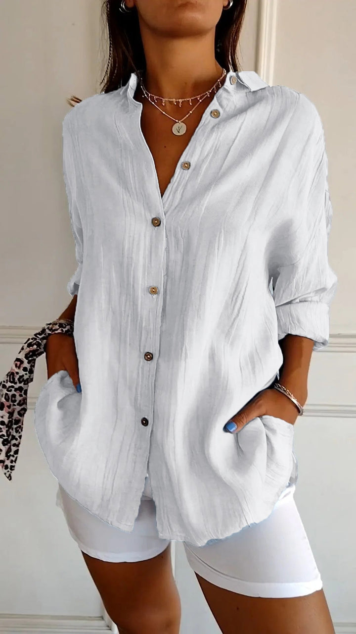 Comfortable and chic women's crinkled long sleeve button-down blouse for versatile styling.