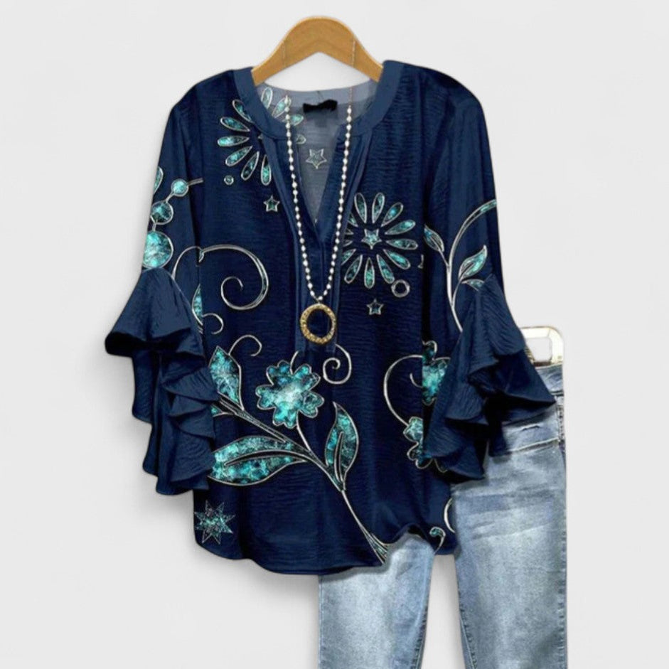Lightweight women's floral print blouse with long flare ruffle sleeves, ideal for a stylish, casual summer look.