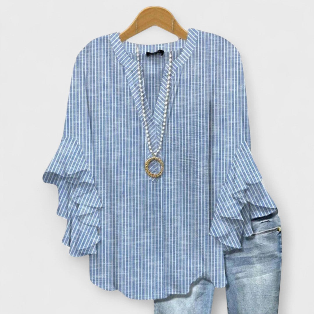 Women's V-neck floral blouse, featuring eye-catching ruffle flare sleeves and a relaxed, flowy silhouette.
