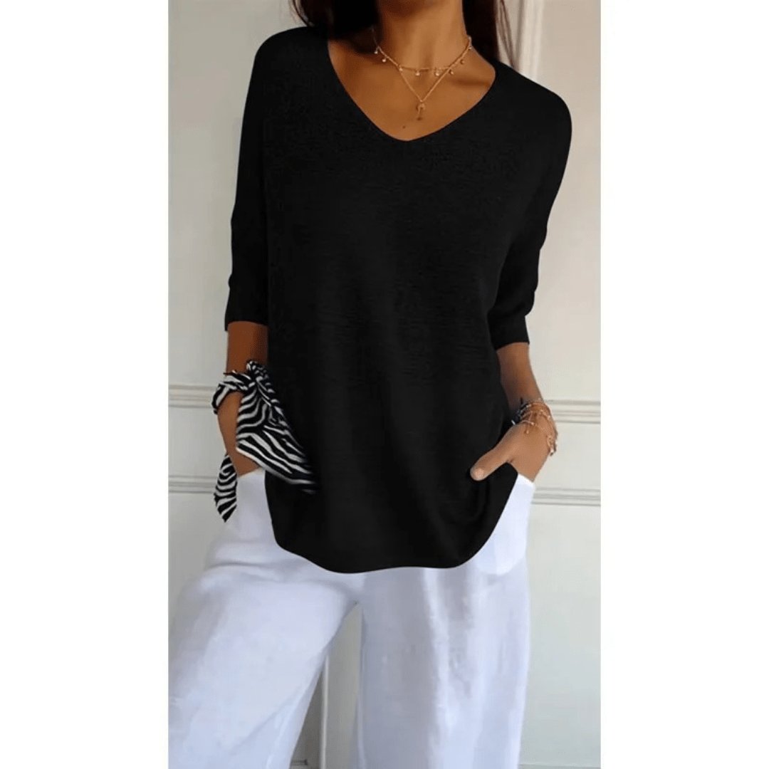 Stylish women's V-neck blouse, loose textured fit, half sleeves. Effortlessly chic for spring & summer style.