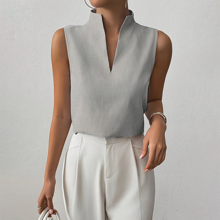 Fashionable women's top: striped pattern, sleeveless, and a sophisticated stand collar for a polished look.