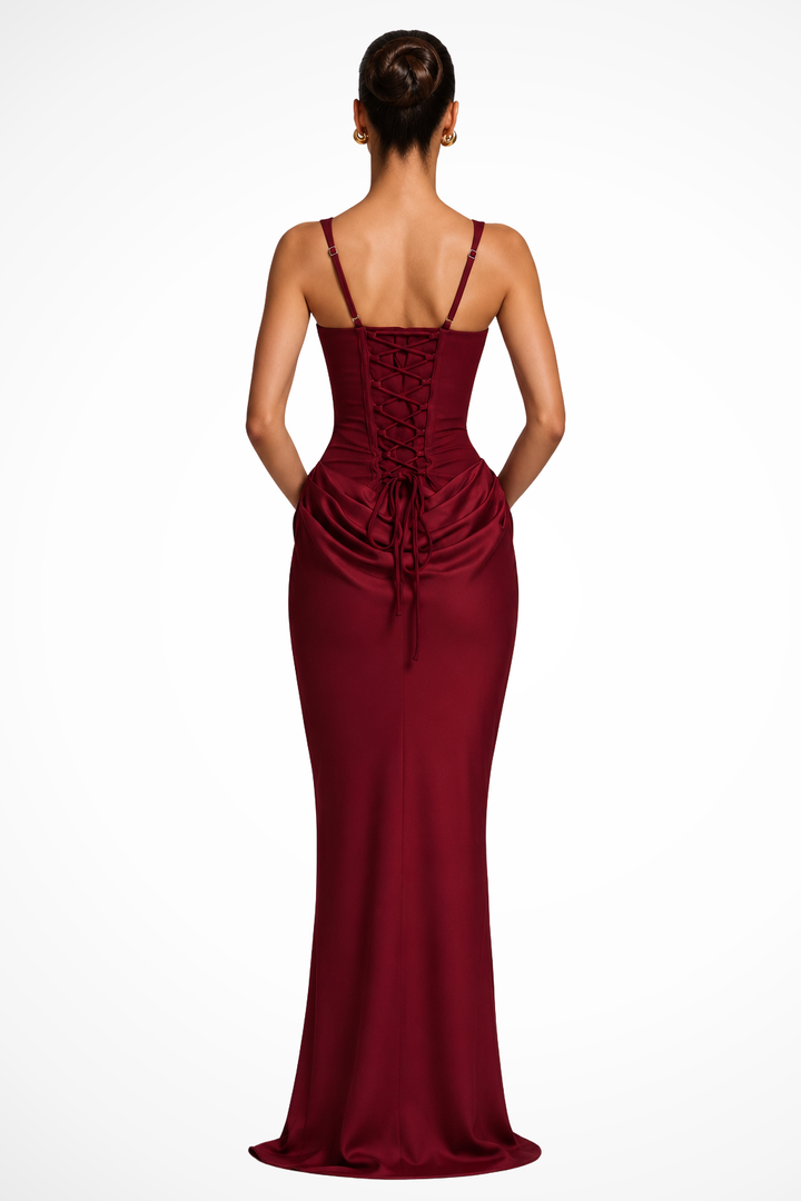 Chic women's black tie maxi dress. Features a square neck, corset bodice, and graceful draped detail.