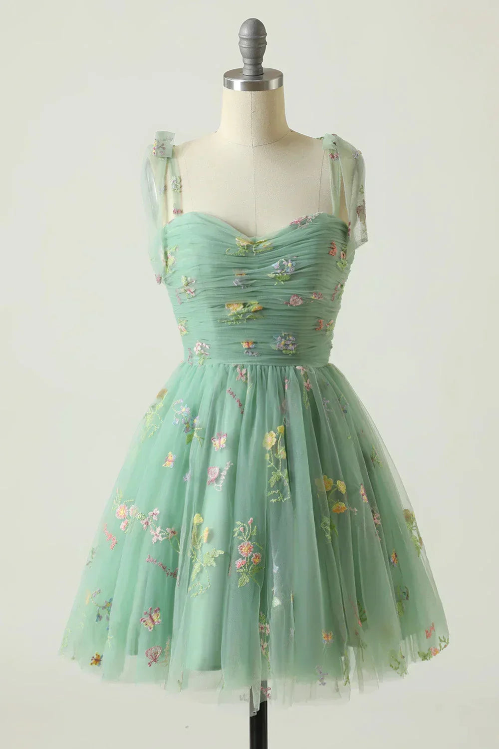 Stunning sleeveless women's summer mini dress, floral embroidered with a lovely layered skirt. Perfect party wear.