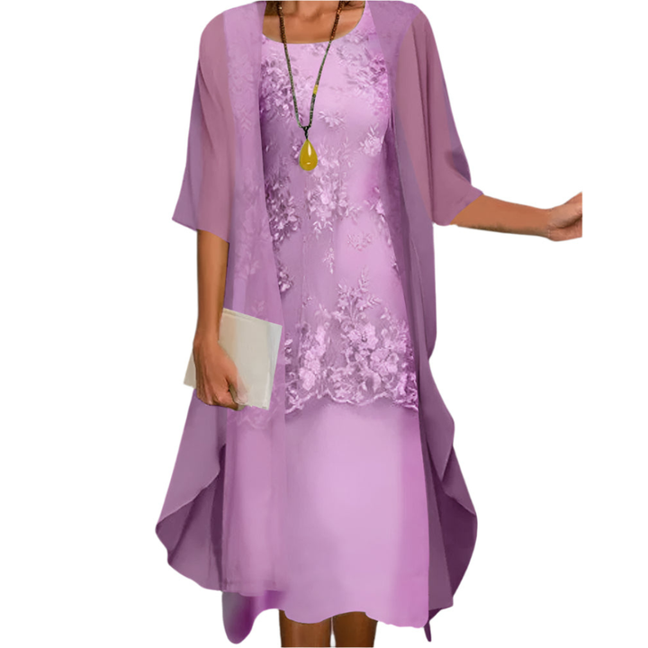 Stylish Women's Flowing Midi Dress featuring sheer transparent sleeves, perfect for a wedding guest or special occasion.