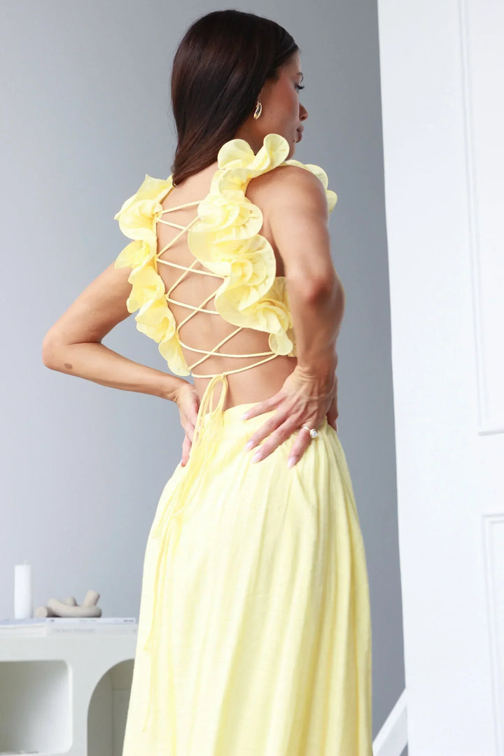 Stylish yellow backless maxi dress. Women's elegant long summer or party dress for formal events.
