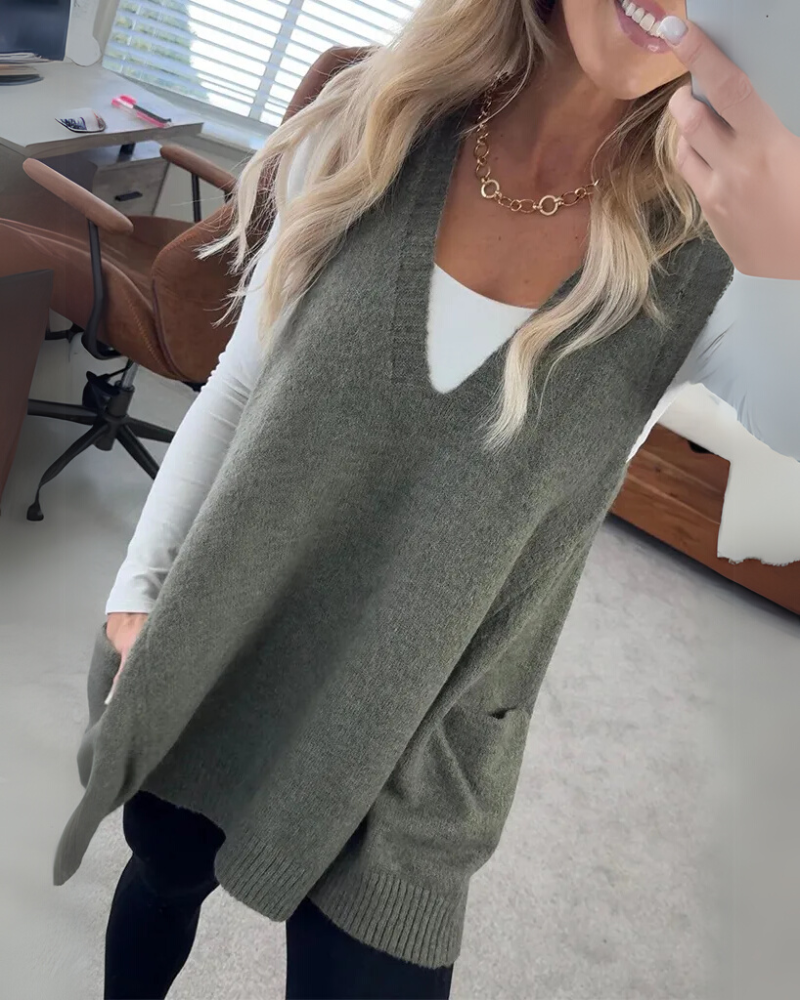 Cozy women's layering vest with A-line fit, ribbed trim & pockets. Versatile for elegant fall & winter style.
