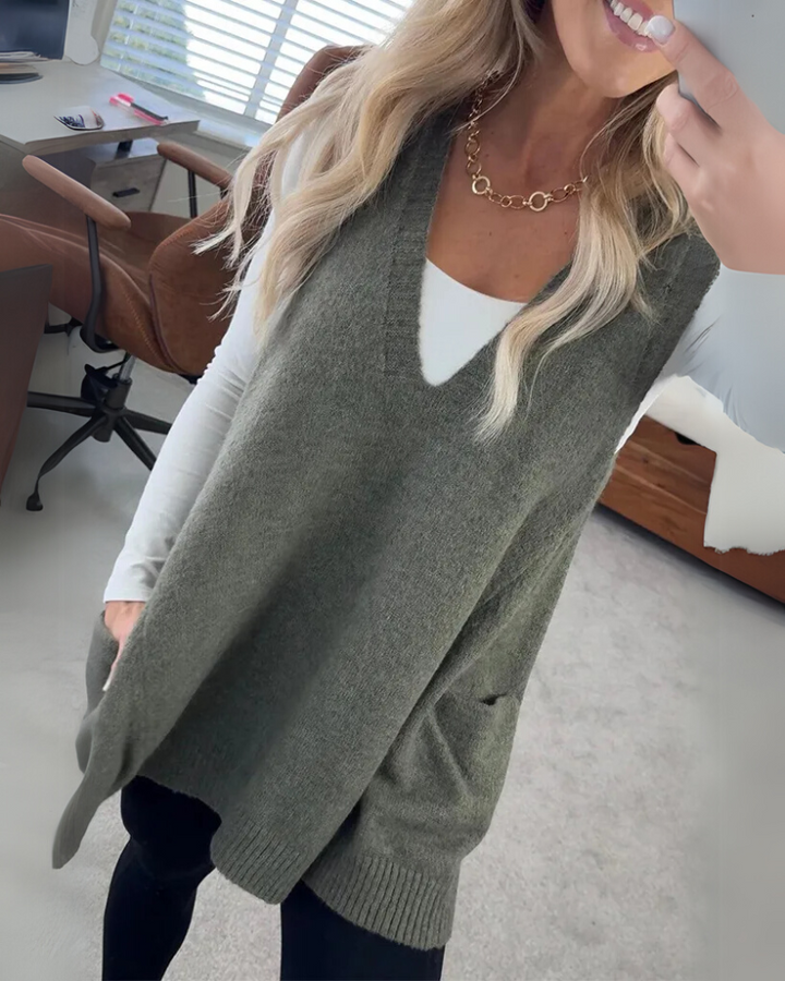 Cozy women's layering vest with A-line fit, ribbed trim & pockets. Versatile for elegant fall & winter style.
