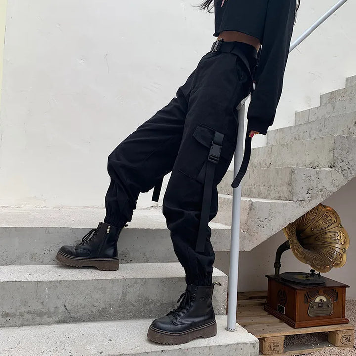 Women's practical high waist elastic cargo pants with multiple pockets, offering comfort & utility for any day.