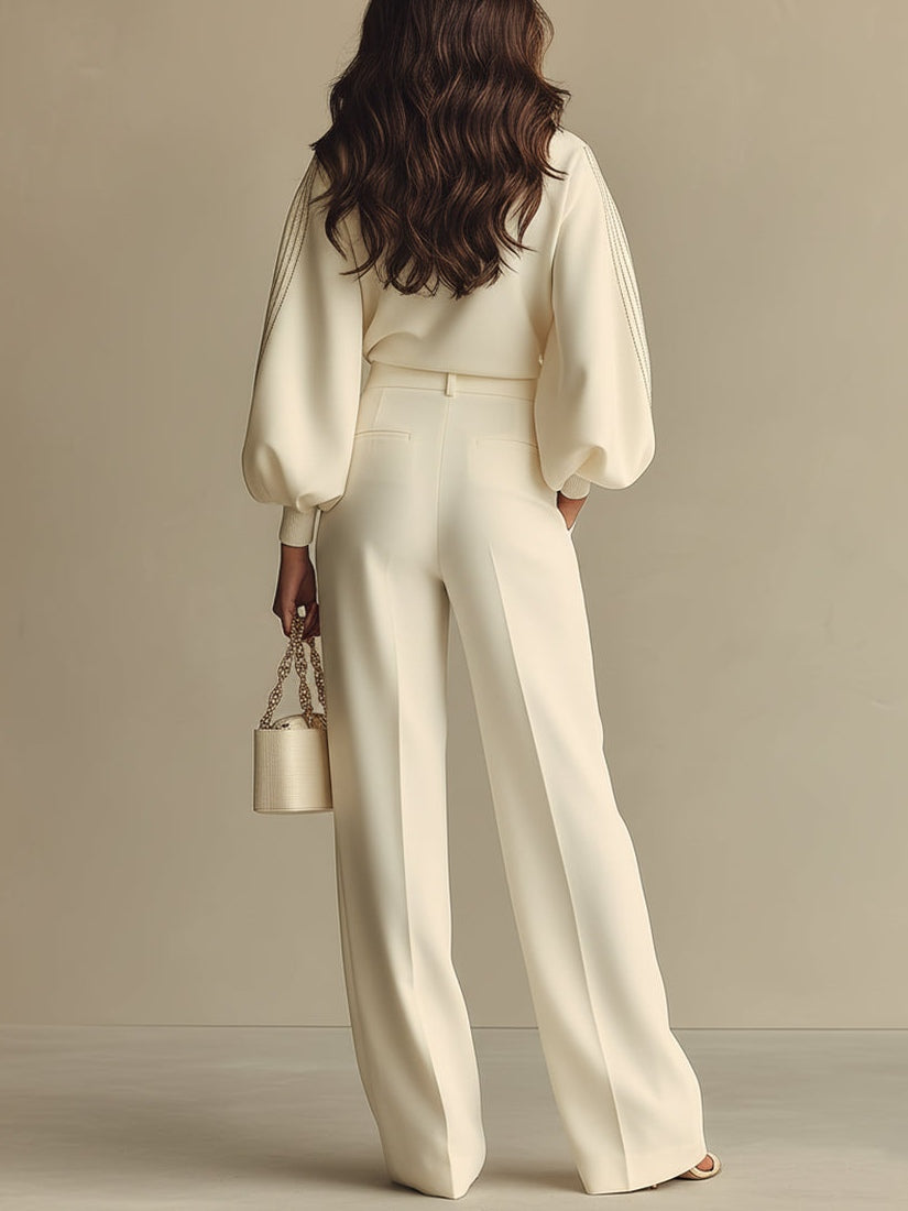 Fashionable women's knit two-piece set, featuring a relaxed crew neck top and elastic high-waist knit bottoms. Versatile wear.