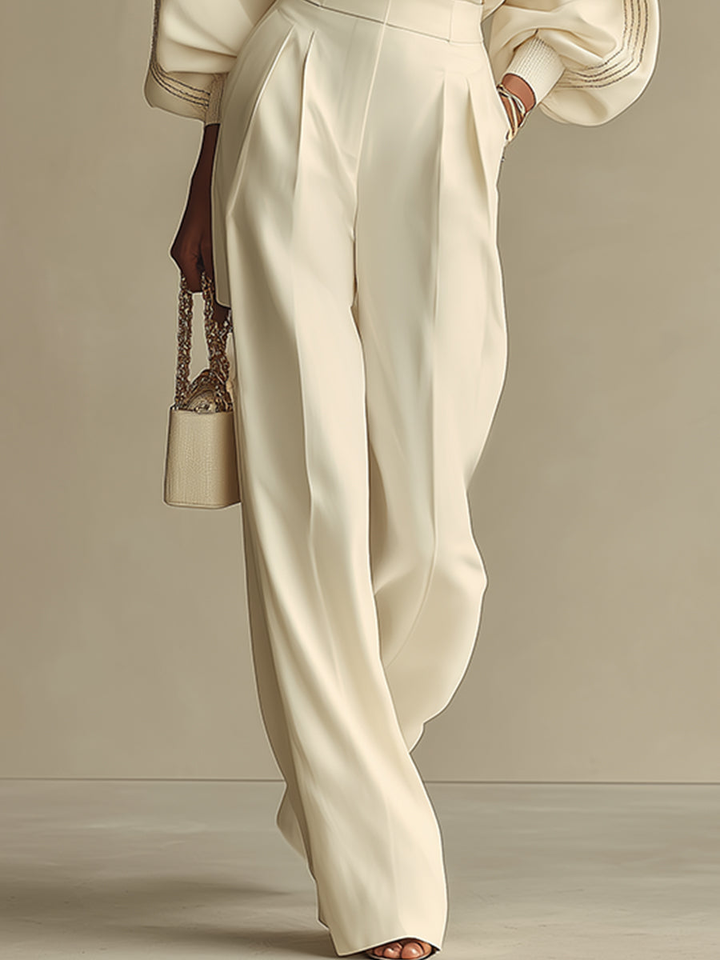 Comfortable women's knit two-piece outfit with a cozy crew neck top & flattering high-waist knit pants. Chic casual style.