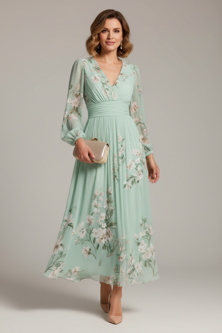 Close-up of elegant V-neck floral midi dress, showcasing delicate fabric and vibrant summer flower print.