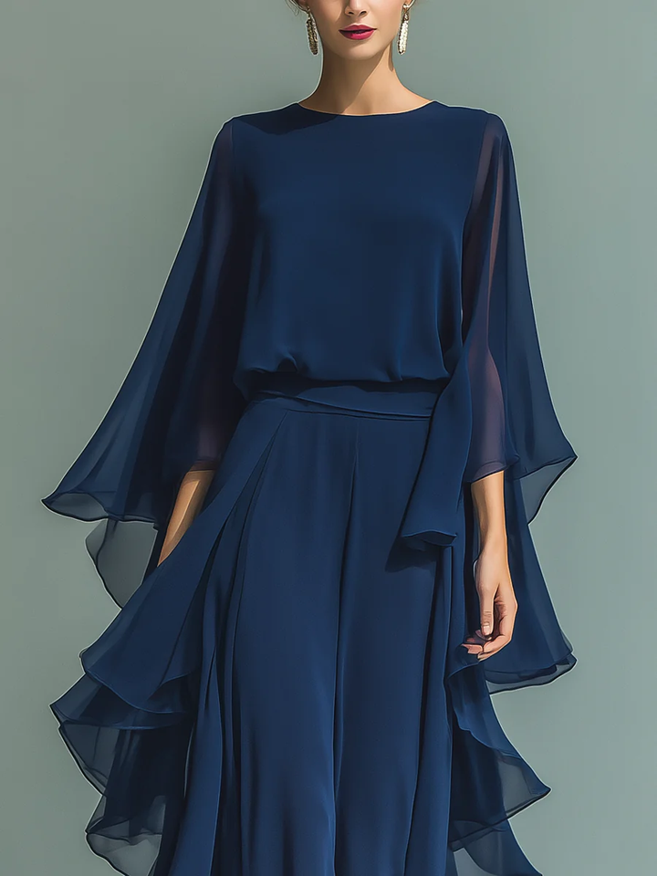Sophisticated women's evening ensemble: a top with ruffled flared sleeves & matching straight leg pants for formal wear.