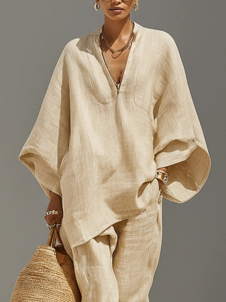 Minimalist women's light khaki asymmetrical top and jogger set, a comfortable two-piece lounge outfit.