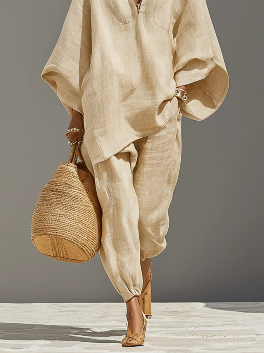 Stylish women's light khaki jogger set with an elegant asymmetrical top; a versatile and comfy two-piece.