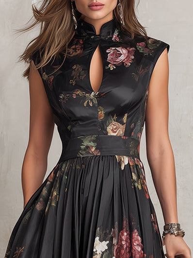 Detailed view of a black floral pleated midi dress for women, highlighting its elegant keyhole collar neckline.
