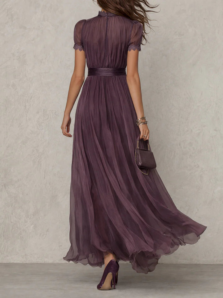 Purple keyhole neckline maxi dress featuring elegant puff sleeves & flowing pleats. Women's summer/autumn style.