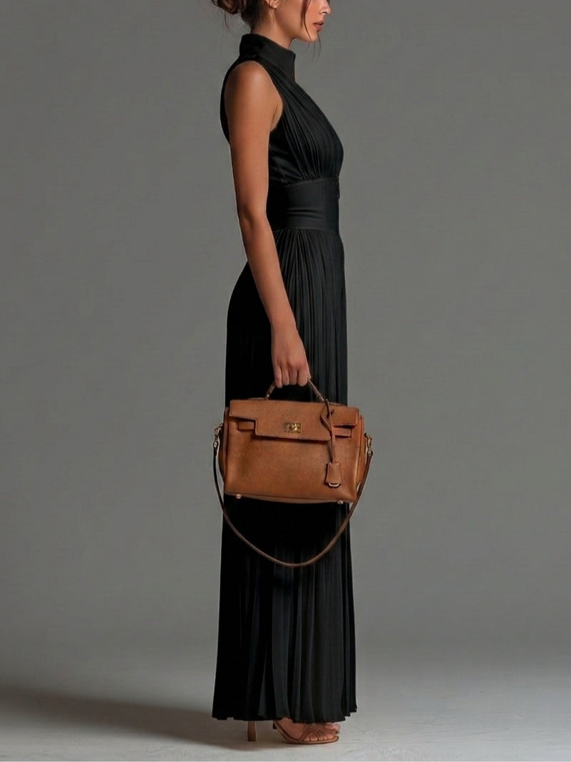 Flattering sleeveless V-neck pleated wide-leg jumpsuit for women, an elegant choice for evening wear.