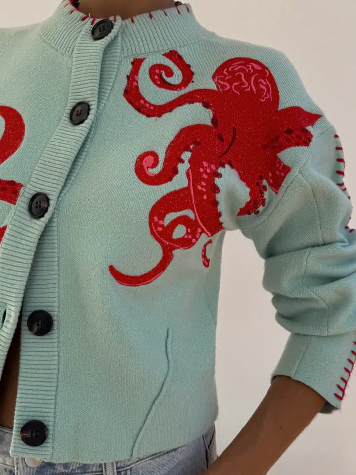 Trendy women's light blue knit cardigan with an octopus pattern. Long sleeve button-front sweater for casual layering.