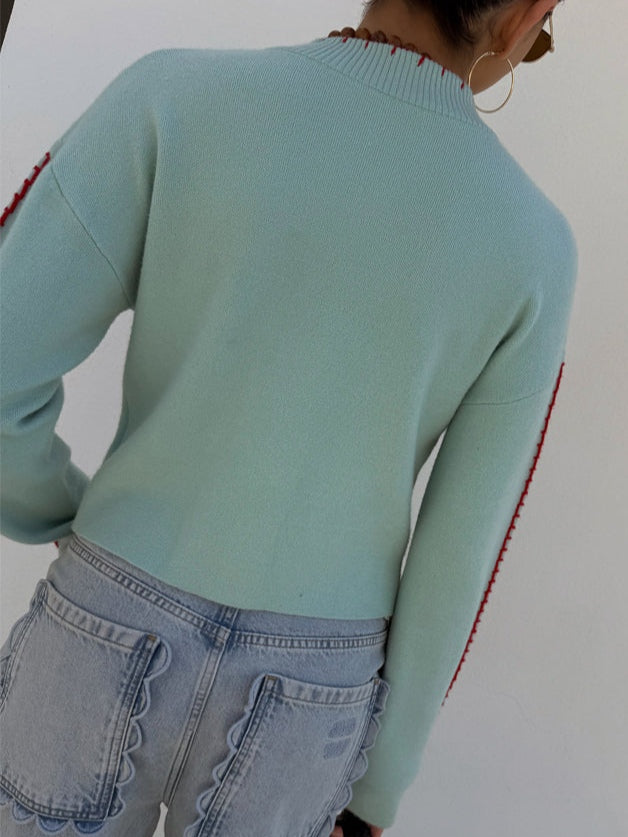 Stylish light blue women's cardigan with an eye-catching octopus knit graphic. Perfect for unique casual layering.