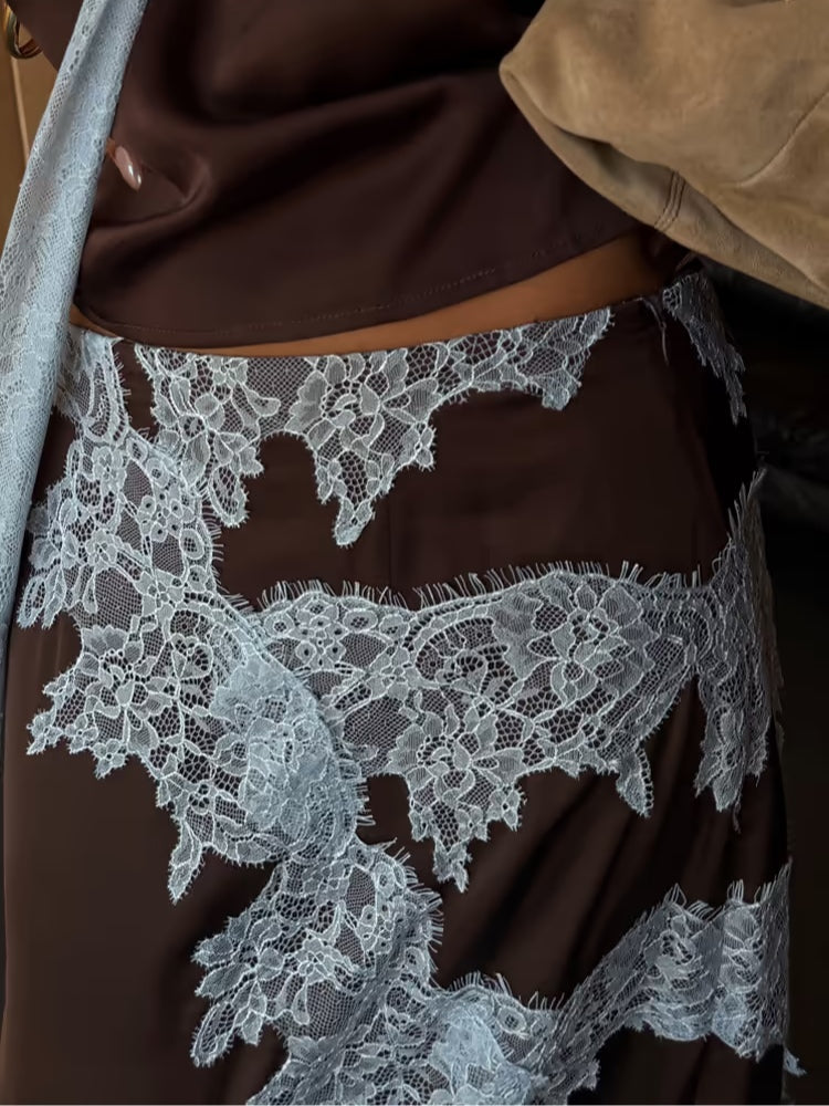 Fashionable women's brown halter crop top & flowing maxi skirt two-piece set for elegant occasions.