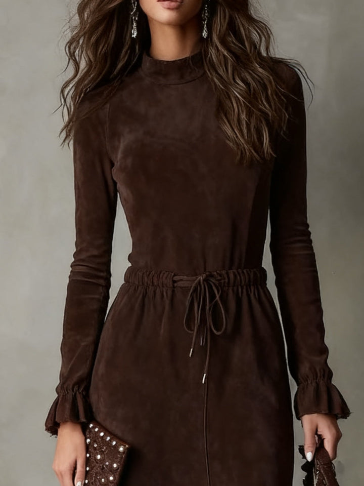 Sophisticated women's long-sleeve midi dress featuring a flattering tie-waist. Comfortable for elegant casual style.
