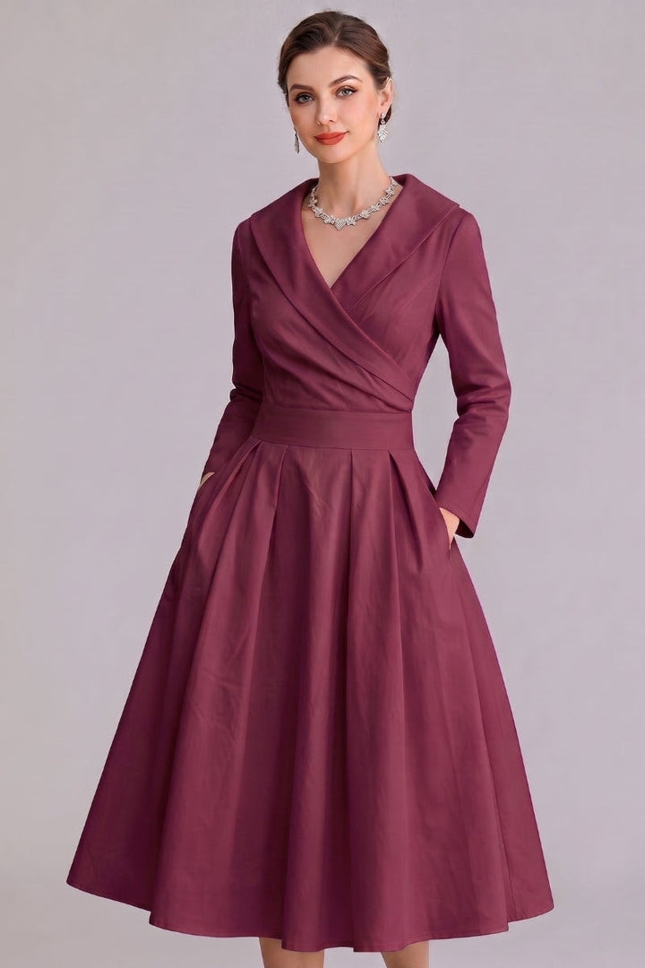 Burgundy elegant midi dress with pockets, ideal for a sophisticated party or evening occasion.