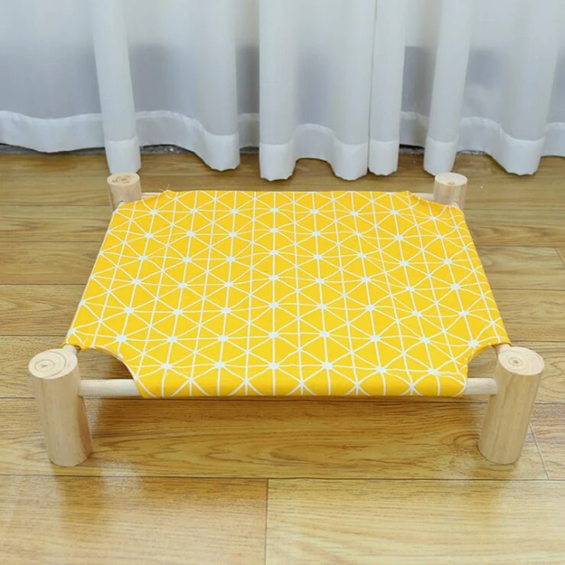 Elevated cat bed provides a cozy, healthy haven, keeping pets off cold floors. Washable cover for easy care.