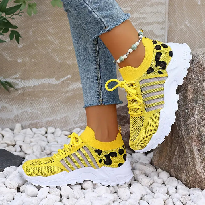 Trendy women's leopard print athletic-style sneakers, breathable & comfortable for daily wear.