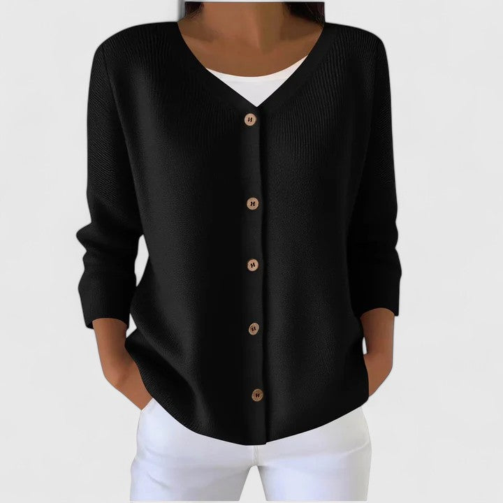 Woman wearing an elegant button-down hooded cardigan, comfortable & stylish for fall.