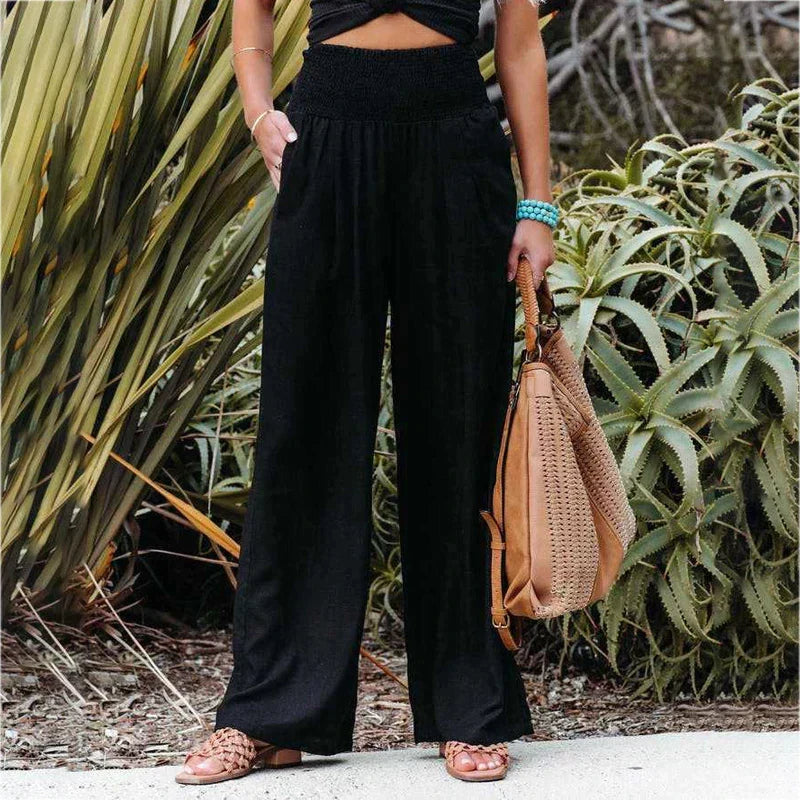 Comfortable women's wide-leg pants with an elastic waist, ideal for relaxed fit and casual elegance.