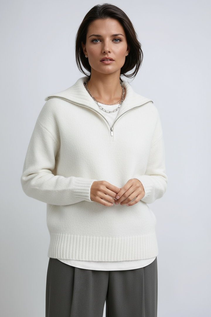 Cozy women's Amara knitted zip-up turtleneck sweater. Stylish pullover in grey, ideal for winter fashion.