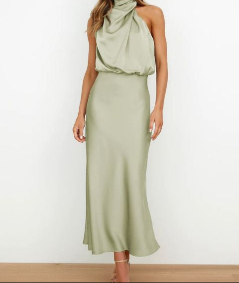 Summer chic: Elegant women's long halter neck evening dress, perfect for sophisticated cocktail parties.