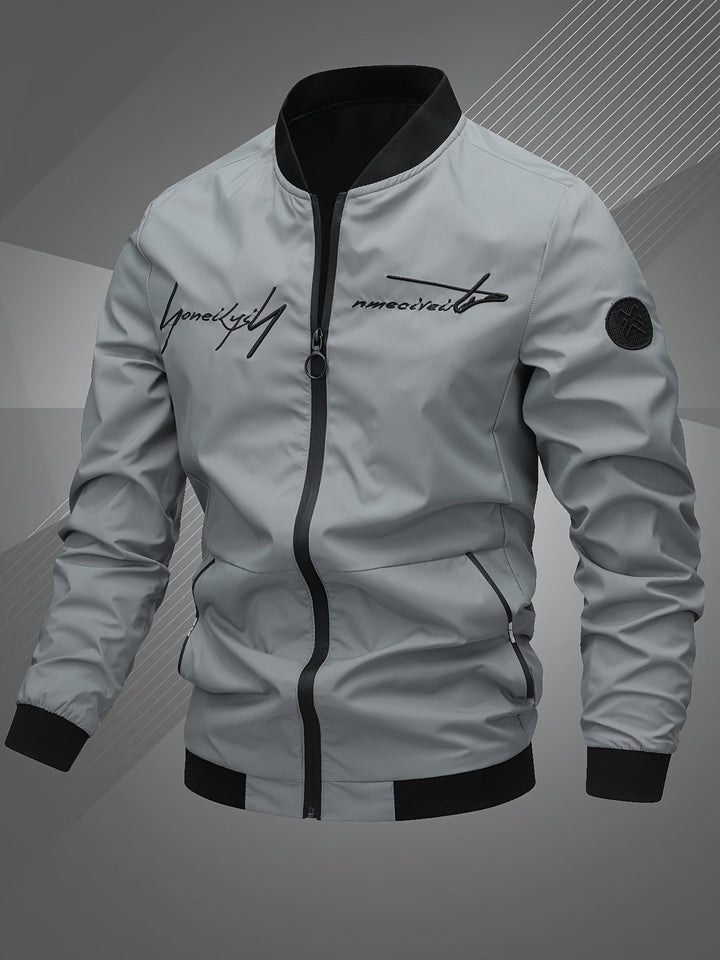 Man wearing a stylish men's bomber jacket with logo, ideal for a modern, comfortable look.
