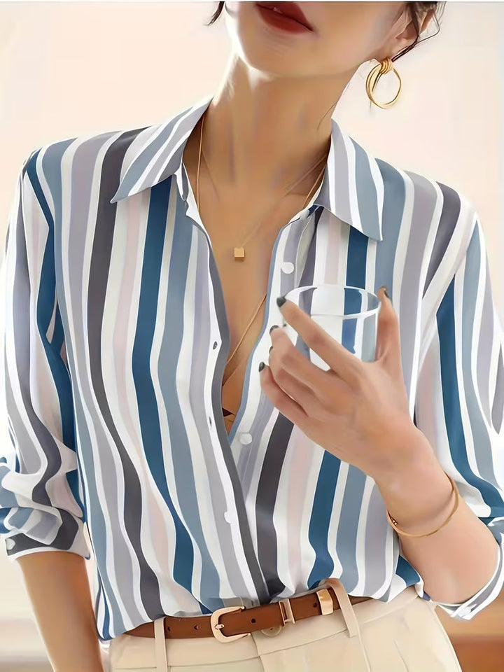 Versatile women's striped long-sleeve button-up shirt. Elegant blouse for office, casual outings, or sophisticated daily wear.