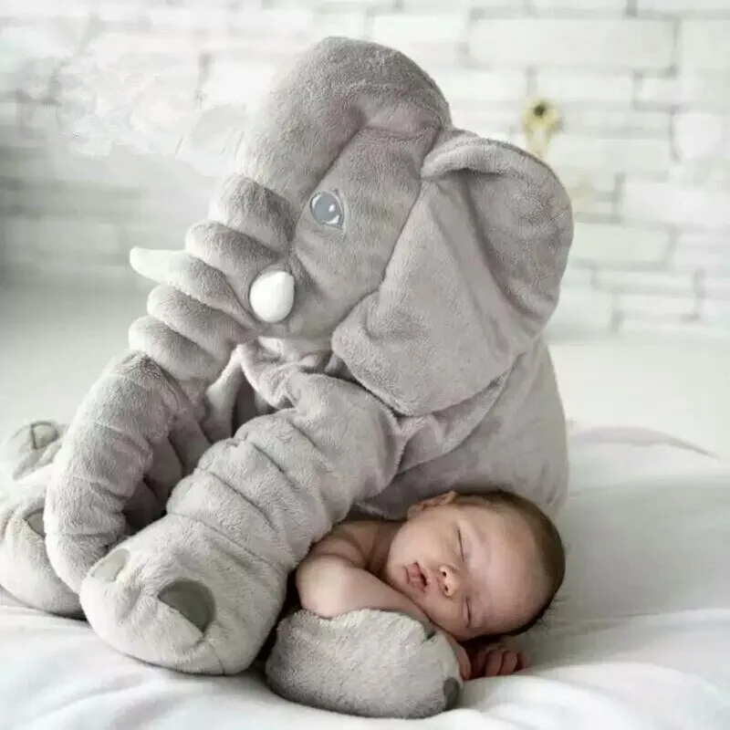 Grey unisex baby elephant plush pillow with big ears, a soft & cute nursery companion.