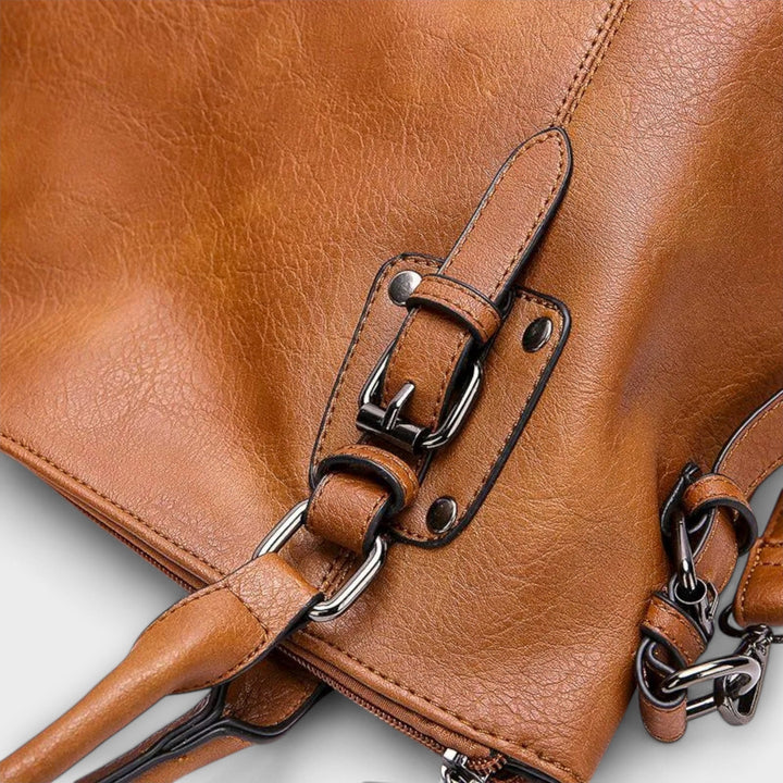 Durable women's luxury leather shoulder bag in a rich brown hue, a sophisticated and stylish everyday accessory.