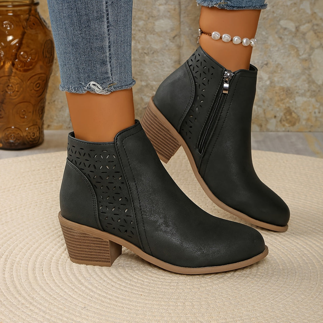 Women's orthopaedic ankle boots in black, offering ultimate comfort and support for daily wear.