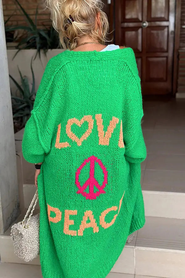 Relaxed fit women's cardigan featuring a bold 'Love & Peace' print, offering a cozy and stylish boho vibe.
